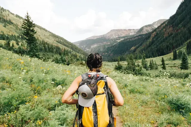 Solo hiker on a mountain trail with a backpack