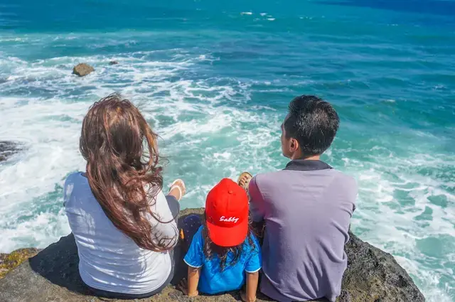 Family enjoying a beach holiday together