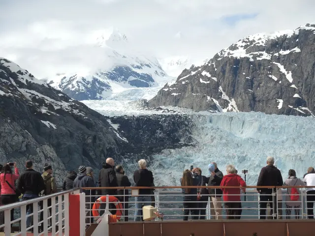 Tourists viewing glacier from cruise ship deck, Alaska