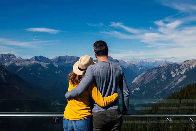 Couple embracing with Banff mountain view, Canada