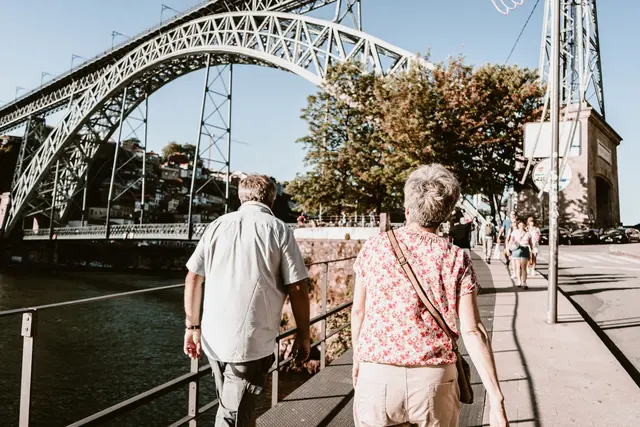 Elderly couple walking near the Dom Luis bridge, Porto, Europe