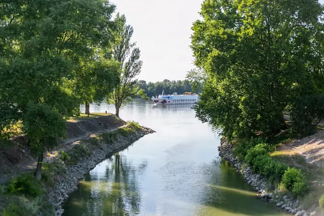 River cruise boat on a scenic European waterway